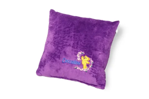 White decorative cushion with detailed Cocolino logo embroidery